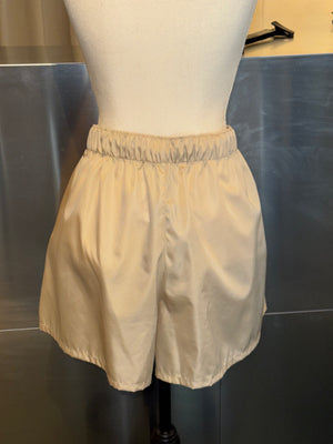 Prada Re Nylon Beige Drawstring Shorts Elastic Waist Wide Leg Enamel Triangle Logo Technical Fabric Sporty Designer Bermuda Shorts New with Tags Size IT 46
