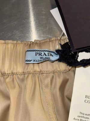Prada Re Nylon Beige Drawstring Shorts Elastic Waist Wide Leg Enamel Triangle Logo Technical Fabric Sporty Designer Bermuda Shorts New with Tags Size IT 46