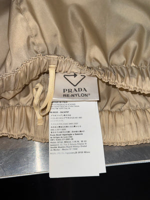 Prada Re Nylon Beige Drawstring Shorts Elastic Waist Wide Leg Enamel Triangle Logo Technical Fabric Sporty Designer Bermuda Shorts New with Tags Size IT 46