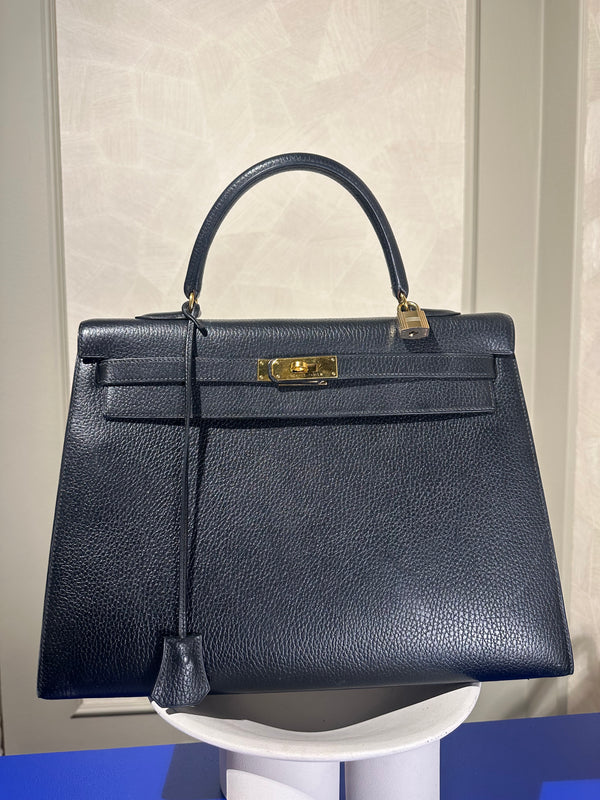 Hermès Kelly 32 Handbag Black Top Handle Vintage Clochette Lock Black leather Gold Hardware Very Good Condition Iconic