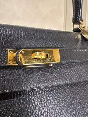 Hermès Kelly 32 Handbag Black Top Handle Vintage Clochette Lock Black leather Gold Hardware Very Good Condition Iconic