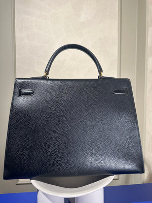 Hermès Kelly 32 Handbag Black Top Handle Vintage Clochette Lock Black leather Gold Hardware Very Good Condition Iconic