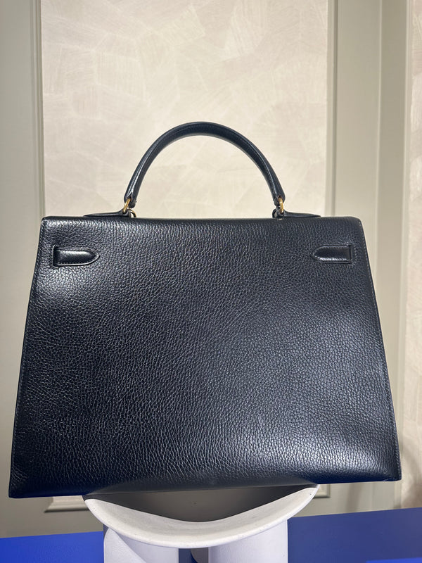 Hermès Kelly 32 Handbag Black Top Handle Vintage Clochette Lock Black leather Gold Hardware Very Good Condition Iconic