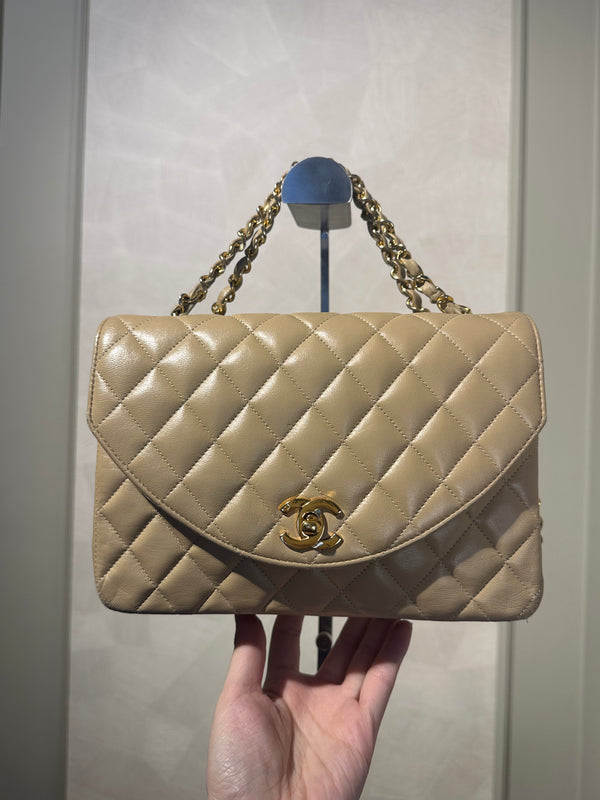 Chanel Beige Small Curved Flap Quilted Lambskin Vintage CC Half Moon Single Flap Shoulder 24k Gold chain Hardware Classic Iconic