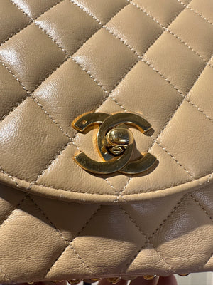 Chanel Beige Small Curved Flap Quilted Lambskin Vintage CC Half Moon Single Flap Shoulder 24k Gold chain Hardware Classic Iconic