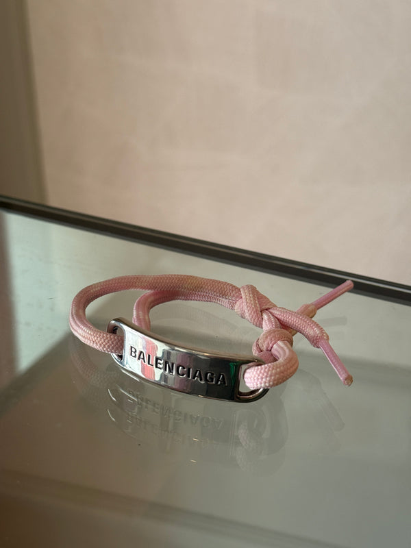 Balenciaga pink cord bracelet Designer-engraved brushed silver-tone plaque, adjustable "Balenciaga" enscription