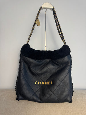 Chanel 2023 Shearling Trim Quilted Small 22 Lambskin Hobo Bag Black Gold Leather CC Coco Mark Chain Strap