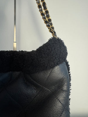 Chanel 2023 Shearling Trim Quilted Small 22 Lambskin Hobo Bag Black Gold Leather CC Coco Mark Chain Strap