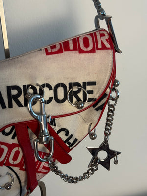 Rare Vintage Christian Dior "Hardcore" piercing graphic limited edition Saddlebag S/S 2003 John Galliano White Black red chain charm detailing