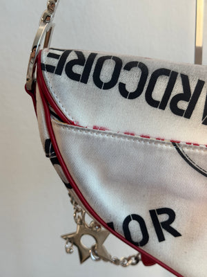Rare Vintage Christian Dior "Hardcore" piercing graphic limited edition Saddlebag S/S 2003 John Galliano White Black red chain charm detailing